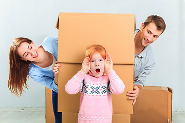 Image showing The happy family  during repair and relocation