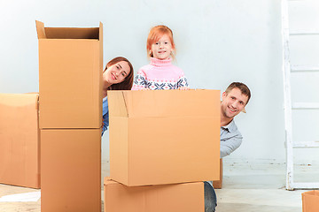 Image showing The happy family  during repair and relocation