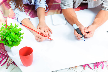 Image showing The hands of  family  at repair and relocation