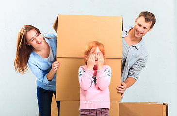 Image showing The happy family  during repair and relocation