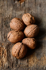 Image showing whole walnuts on wooden table