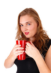 Image showing Blond woman drinking coffee.