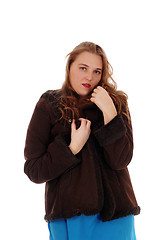 Image showing Pretty woman in a brown winter jacked.