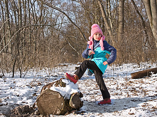 Image showing Little girl in the forest in wintertime