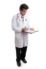 Image showing Doctor writing up patient record