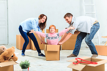 Image showing The happy family  during repair and relocation