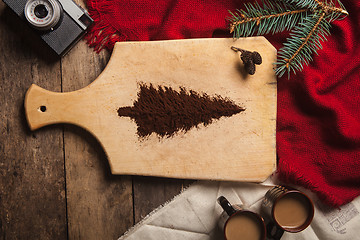 Image showing The two cups of coffee on wooden background