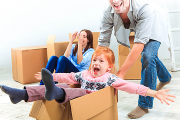 Image showing The happy family  during repair and relocation