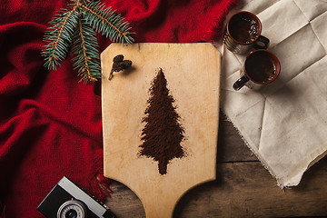 Image showing The two cups of coffee on wooden background