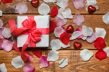 Image showing Valentines Day gift and hearts  on wooden background