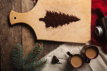 Image showing The two cups of coffee on wooden background