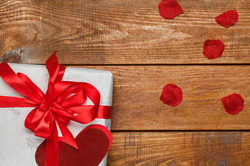 Image showing Valentines Day gift and hearts  on wooden background