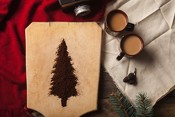 Image showing The two cups of coffee on wooden background