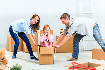 Image showing The happy family  during repair and relocation