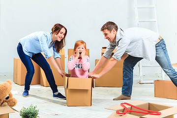 Image showing The happy family  during repair and relocation