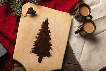 Image showing The two cups of coffee on wooden background