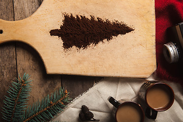 Image showing The two cups of coffee on wooden background