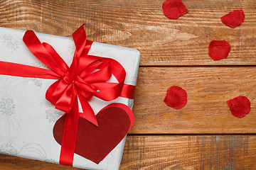 Image showing Valentines Day gift and hearts  on wooden background