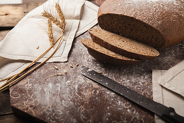 Image showing Bread rye spikelets on an wooden background