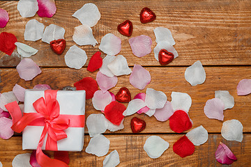 Image showing Valentines Day gift and hearts  on wooden background