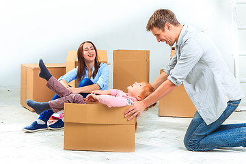 Image showing The happy family  during repair and relocation