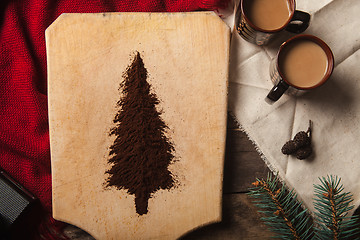 Image showing The two cups of coffee on wooden background