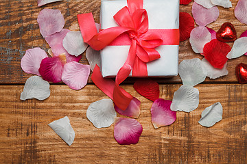 Image showing Valentines Day gift and hearts  on wooden background