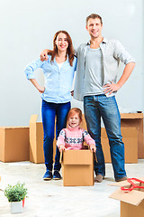 Image showing The happy family  during repair and relocation