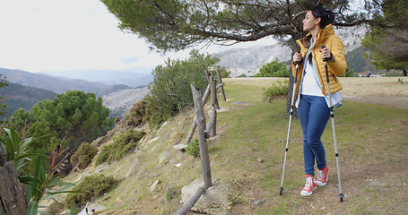 Image showing Hiker looking out from ledge