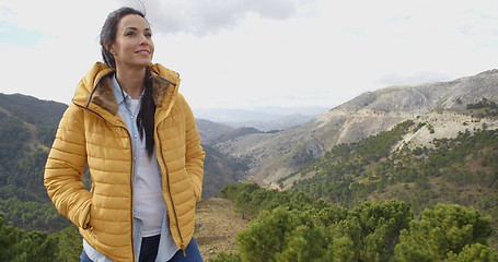 Image showing Smiling woman appreciating the peace of nature