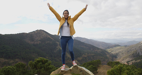 Image showing Female hiker rejoicing in the mountains