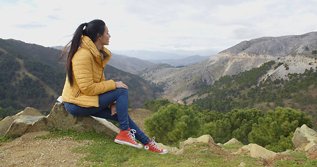 Image showing Calm woman looking into valley