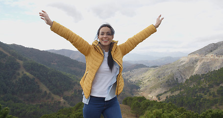 Image showing Female hiker rejoicing in the mountains