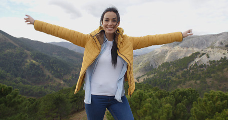 Image showing Fun young woman on a mountain