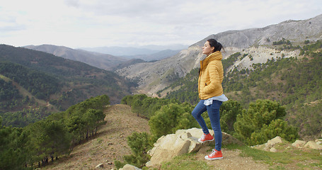 Image showing Young woman on a mountain plateau