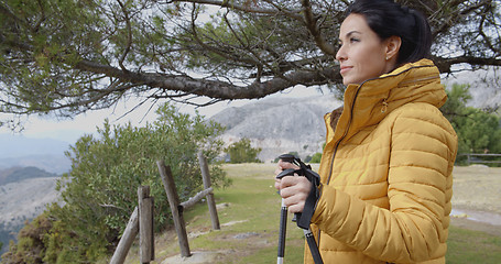 Image showing Hiker looking out from ledge