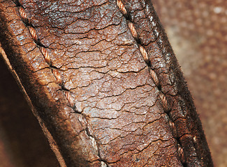 Image showing Close-up of old stiches in leather