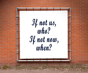 Image showing Large banner with inspirational quote on a brick wall