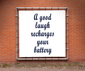 Image showing Large banner with inspirational quote on a brick wall