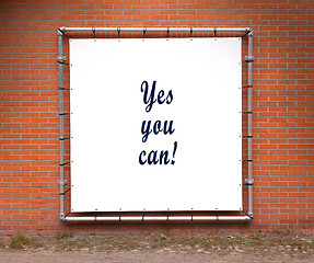 Image showing Large banner with inspirational quote on a brick wall