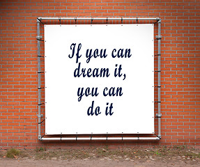 Image showing Large banner with inspirational quote on a brick wall