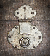 Image showing Old canvas trunk lock close up