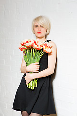 Image showing beautiful woman with a bouquet of roses