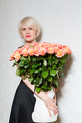 Image showing beautiful woman with a bouquet of roses