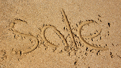 Image showing Word sale handwritten in sand