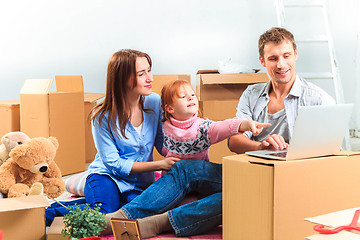 Image showing The happy family  during repair and relocation