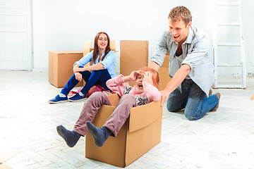 Image showing The happy family  during repair and relocation