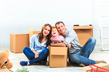 Image showing The happy family  during repair and relocation