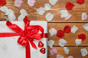 Image showing Valentines Day gift and hearts  on wooden background