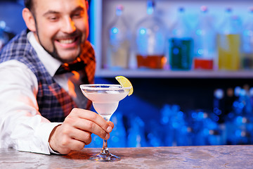 Image showing Barman at work, preparing cocktails.